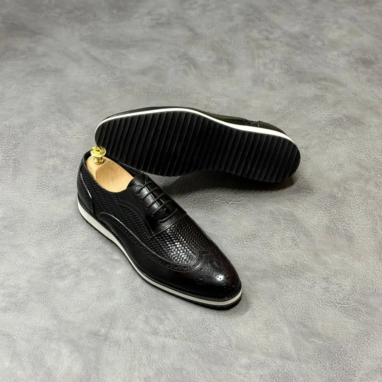 Black woven Wingtip Derby (white sole)