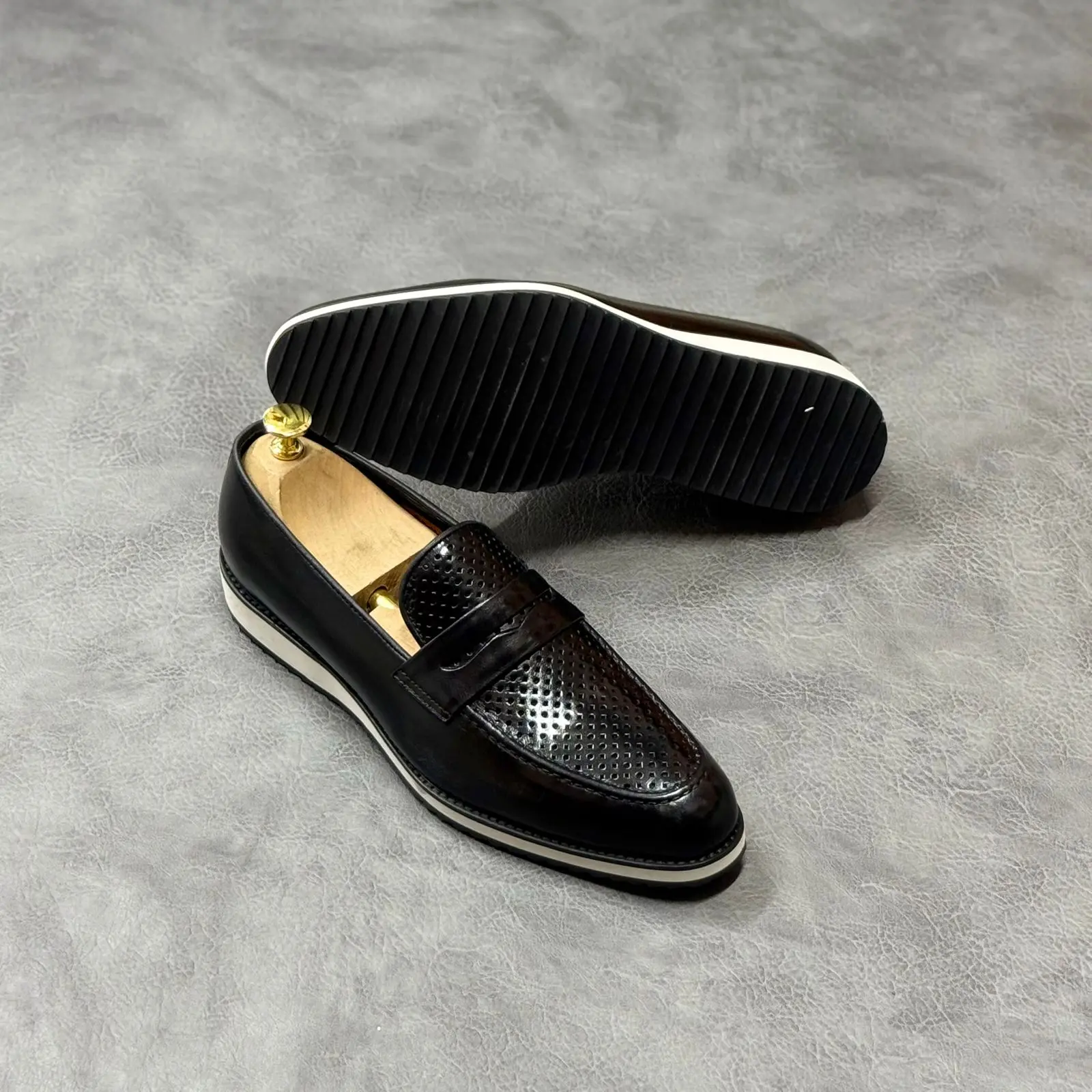 Black perforated penny loafer (white sole)